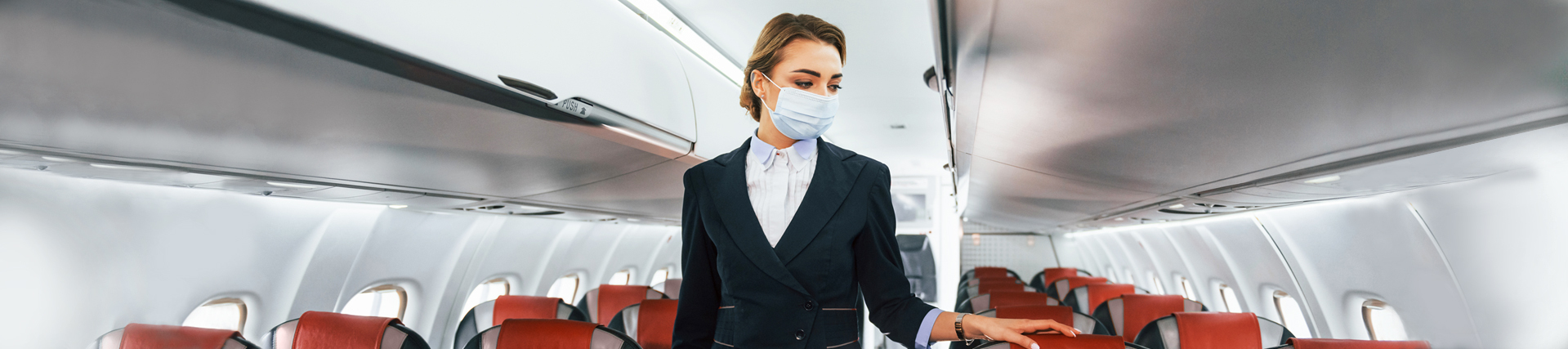 Flight Attendant wearing a mask
