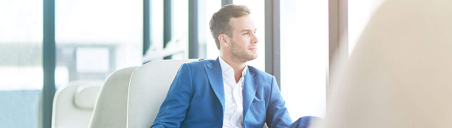 Man looking through a window