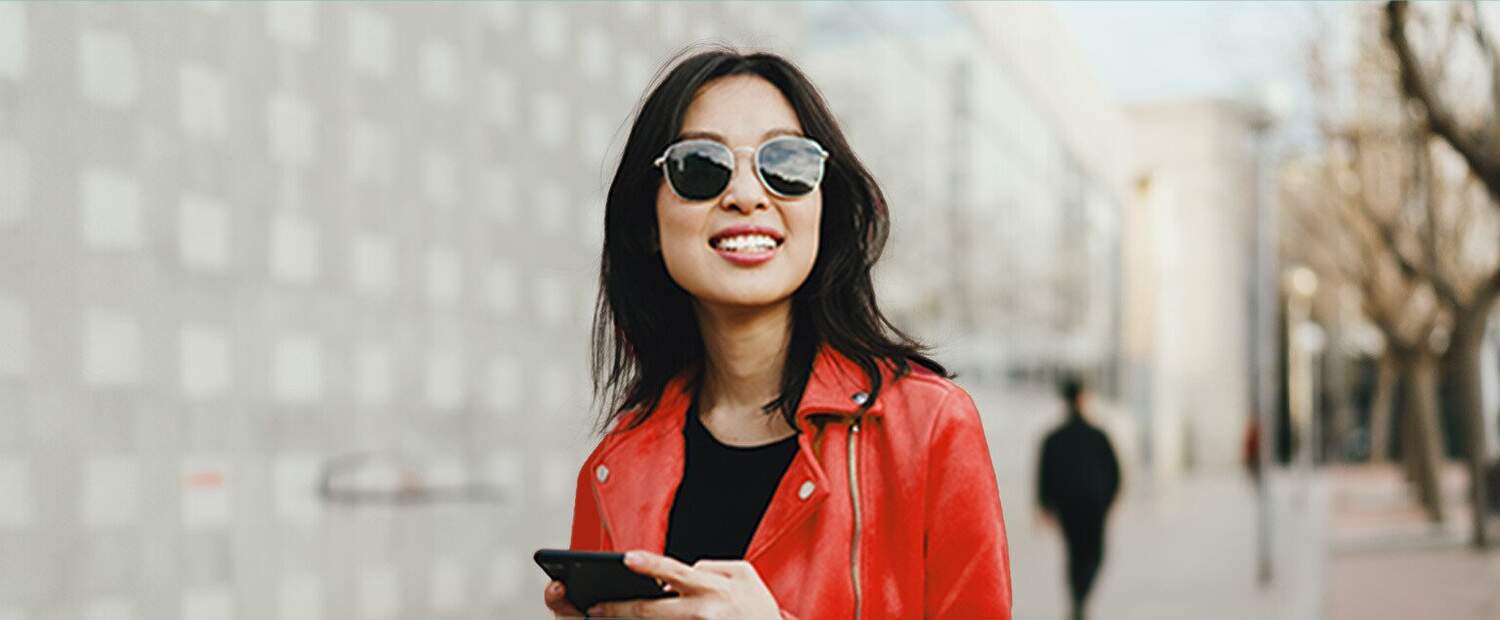Woman With a red coat, glasses, cellphone