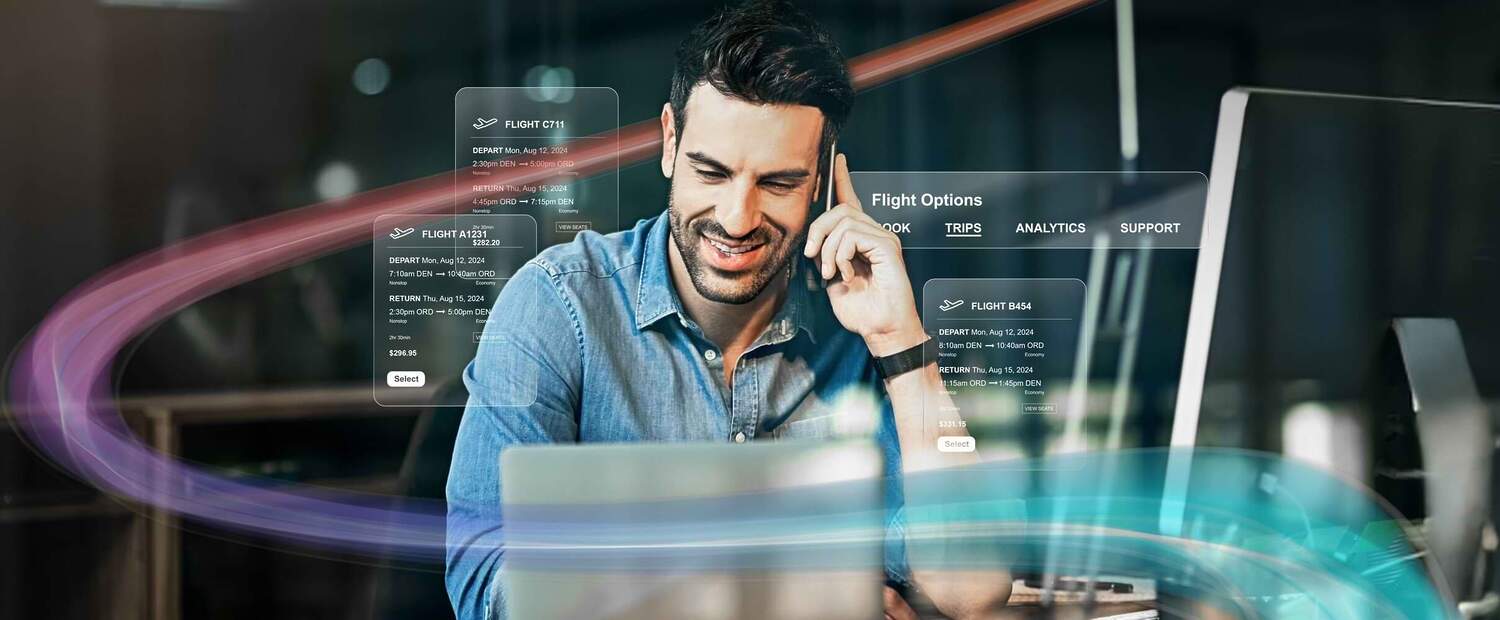 A man in front of a desktop computer