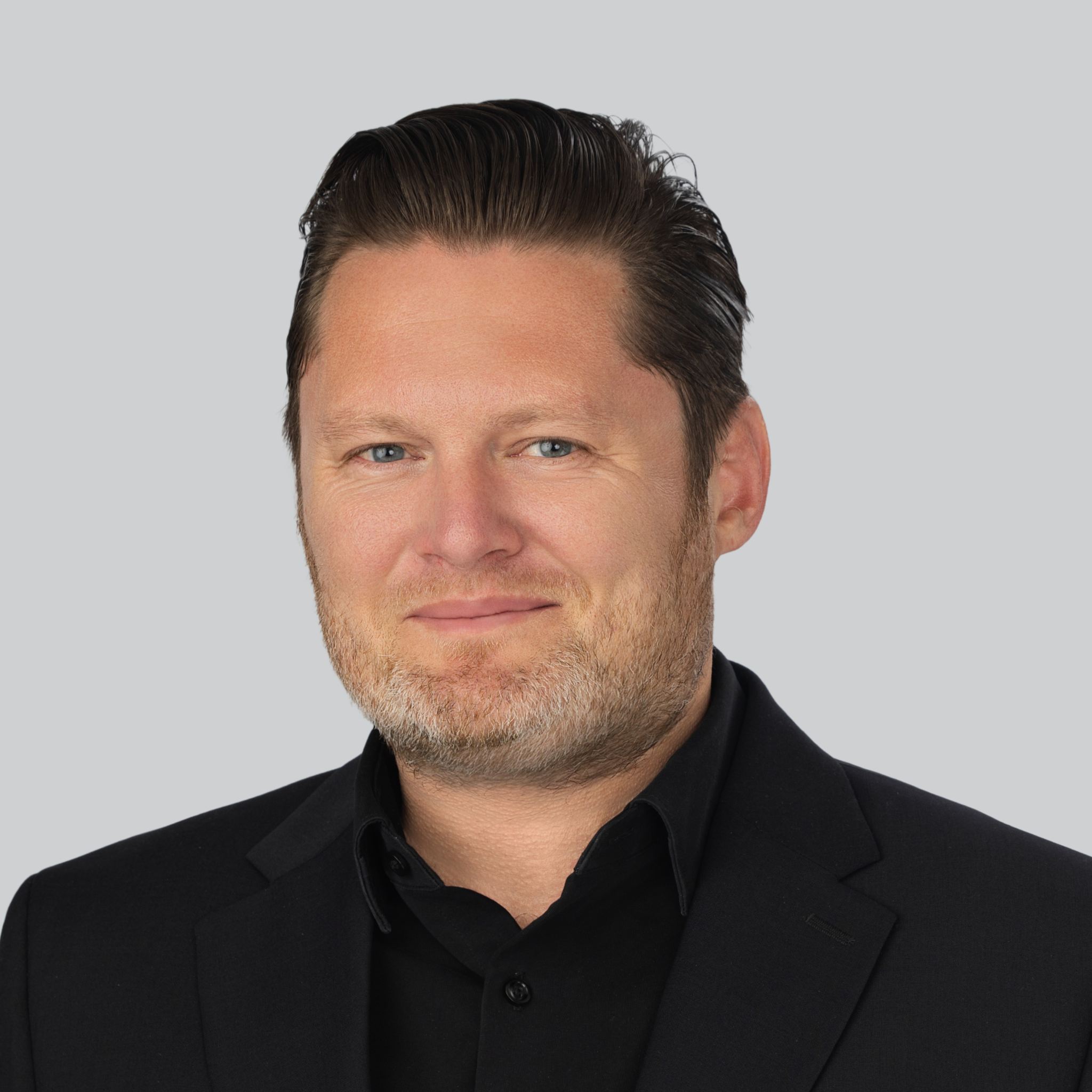 Headshot of Direct Travel's EVP of Data and AI Engineering, Martin Tuncaydin