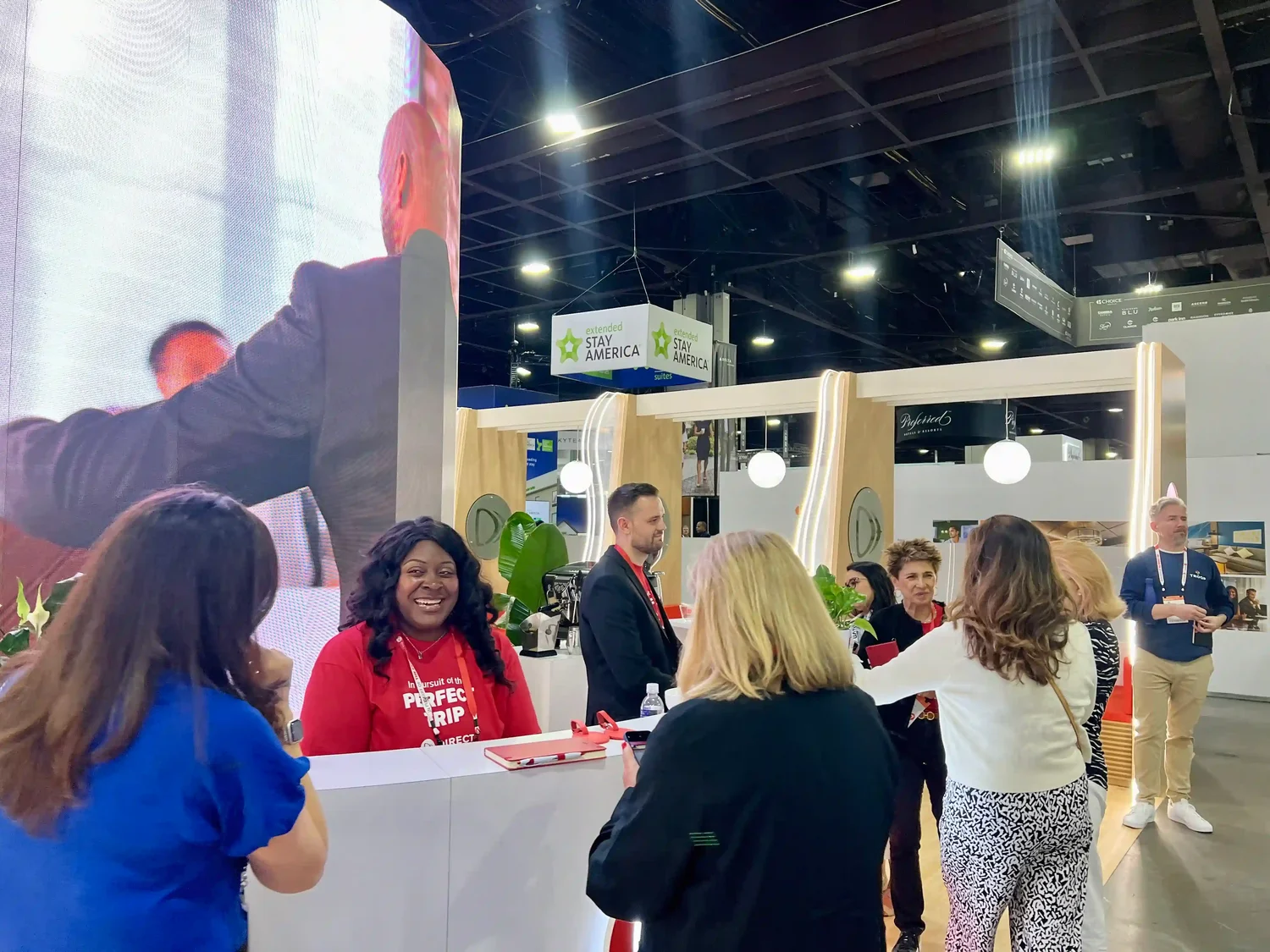 Employees at the Direct Travel Booth at GBTA