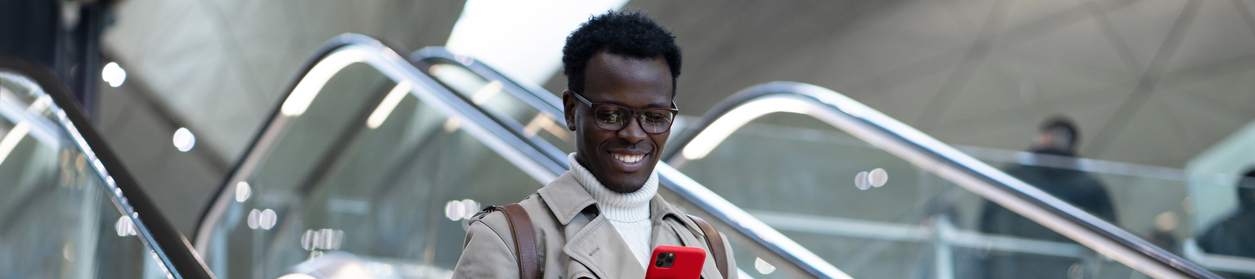Man watching his phone in the stairs